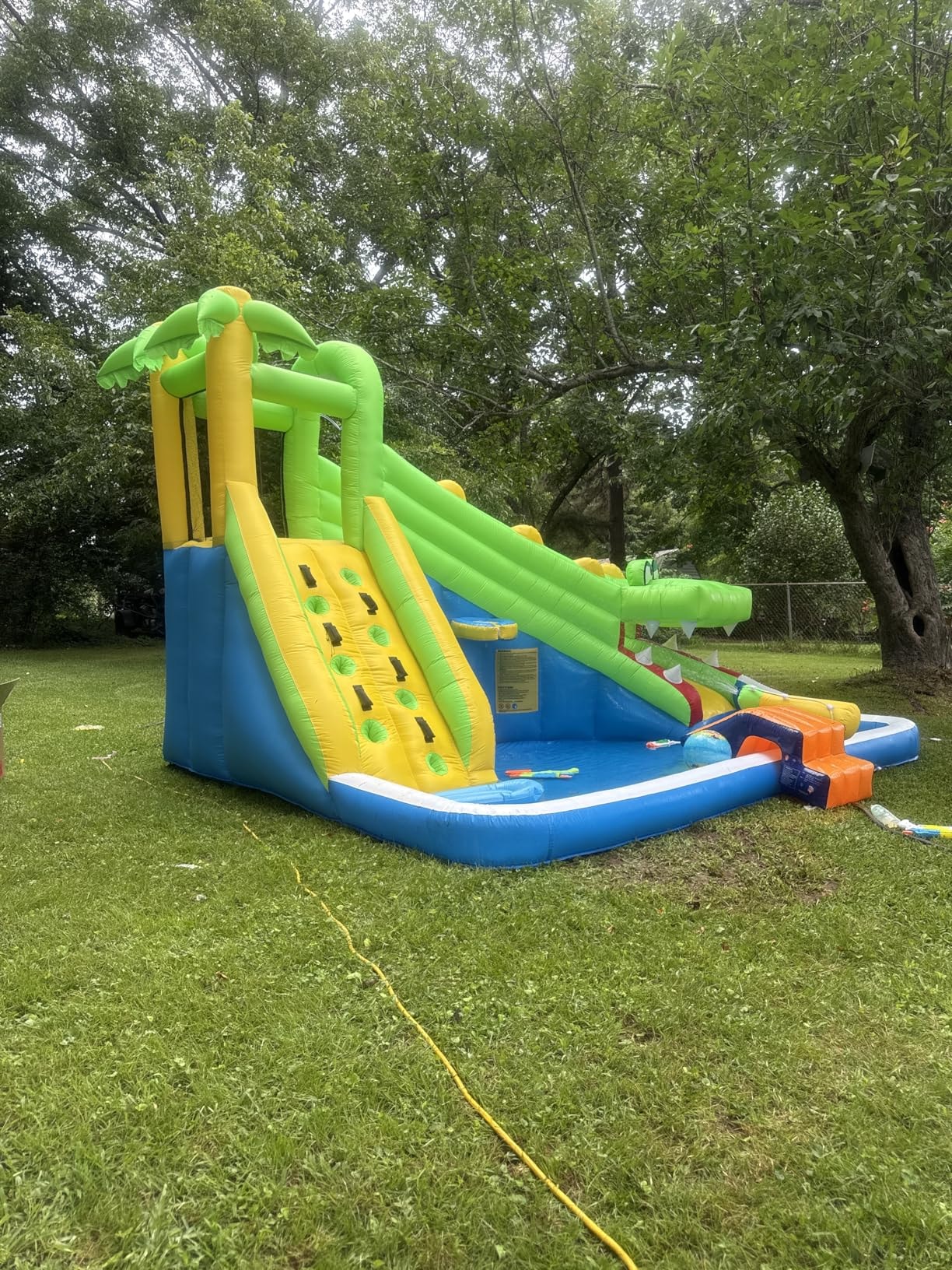 Gator water slide set up outdoors on tarp showing full side profile